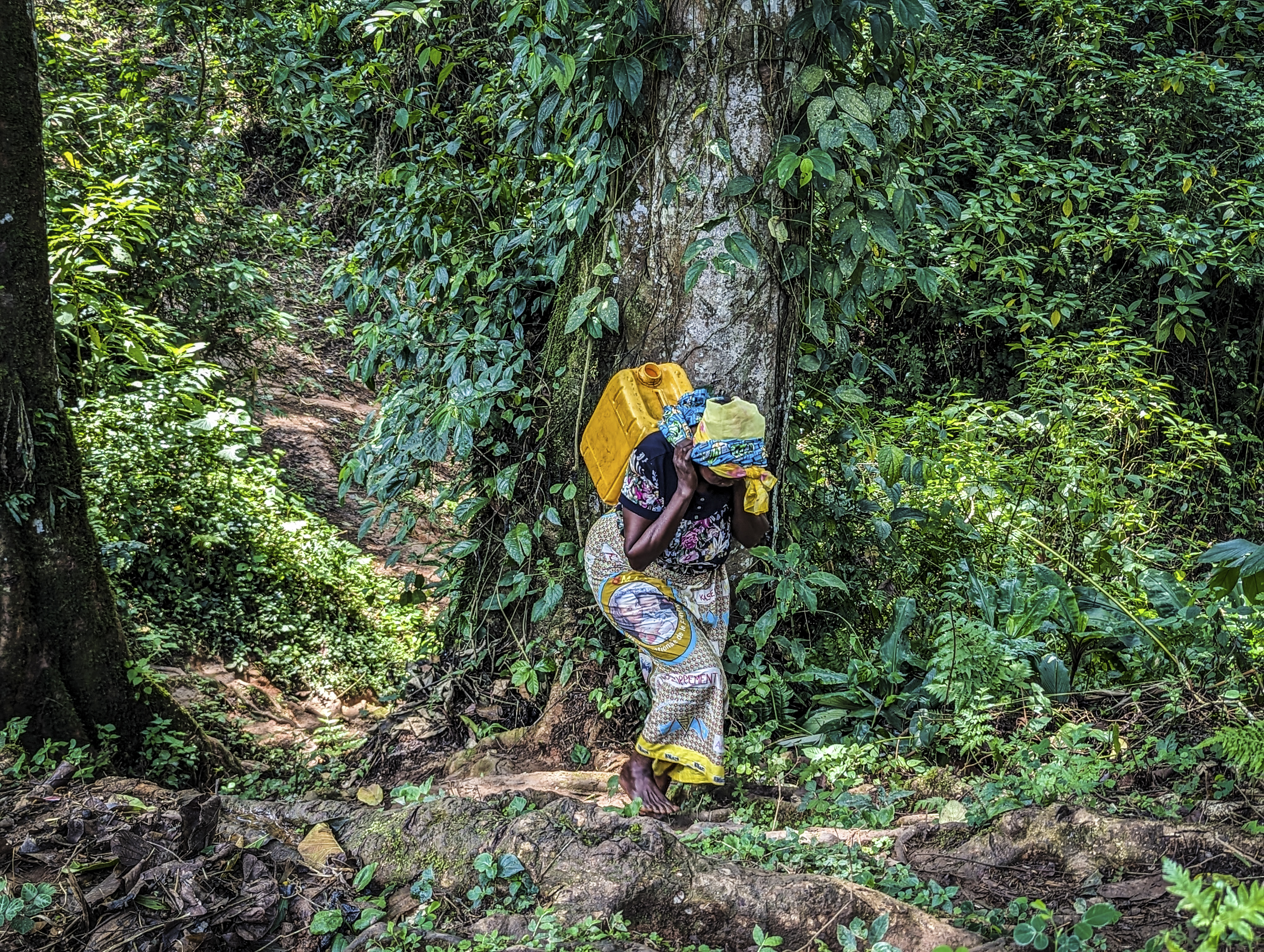 This resilient woman, a mother of ten, tragically lost four brothers to violence in 2020. Driven by fear, she was forced to leave her home and seek refuge with a foster family. To survive, she now cultivates a small field near her former residence. This poignant photograph was captured in 2023 in Kilo, Ituri province, DRC, as she returned from receiving essential seeds from the ICRC. Like many farmers in the region, she carefully tends her land, planting gradually based on the availability of seeds.