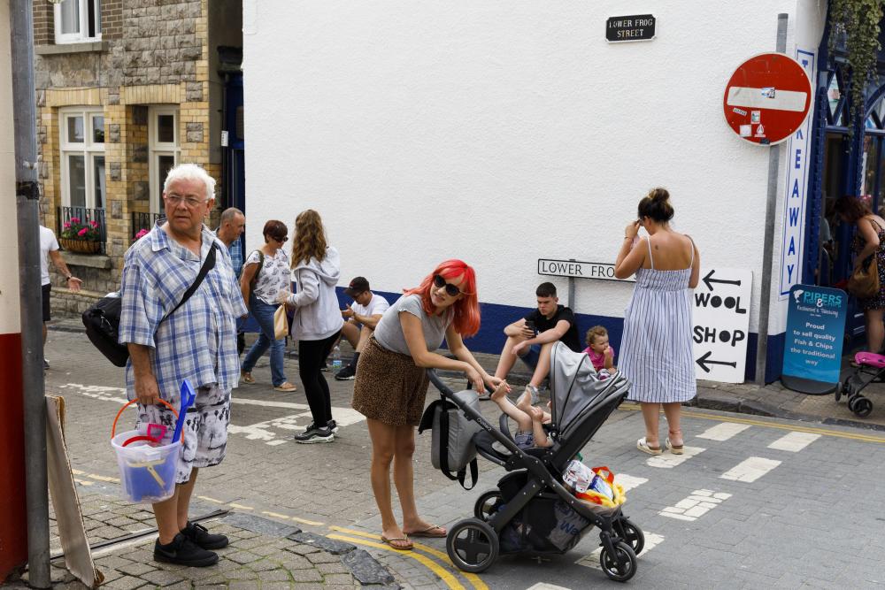 The daily life scene above was pictured by Martin Parr in 2019 in Tenby, Wales, Great Britain
